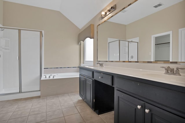 full bath featuring lofted ceiling, visible vents, a sink, a shower stall, and tile patterned floors