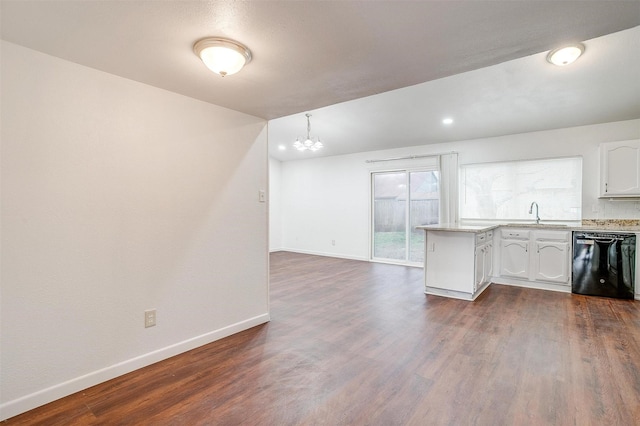 kitchen with dishwasher, light countertops, dark wood-type flooring, and baseboards