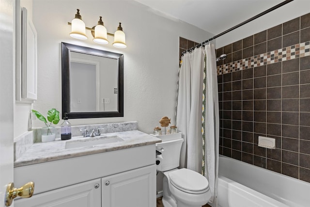 full bath featuring shower / tub combo, vanity, and toilet