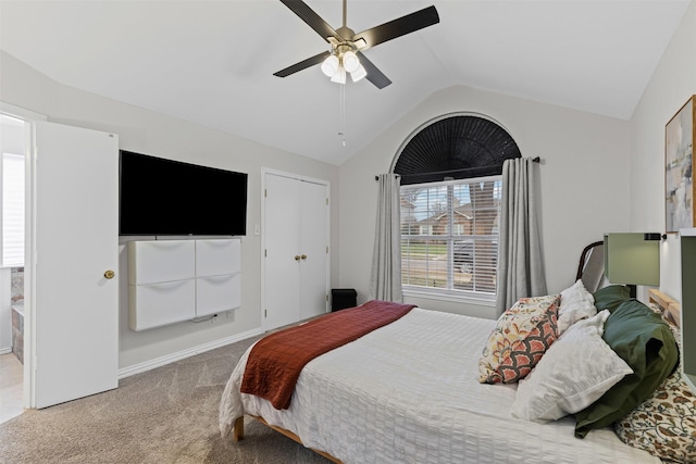 bedroom featuring carpet, vaulted ceiling, baseboards, and ceiling fan