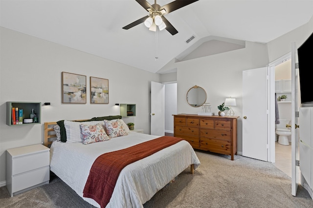 bedroom with ceiling fan, ensuite bathroom, visible vents, vaulted ceiling, and carpet