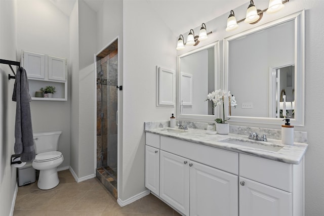 full bathroom featuring a stall shower, a sink, toilet, and tile patterned floors