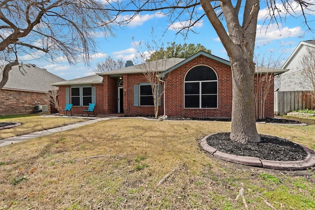 ranch-style house with fence, a front lawn, cooling unit, and brick siding