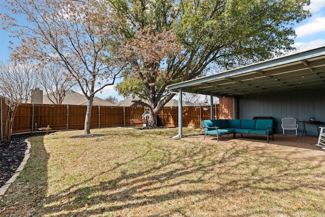 view of yard featuring a patio area, a fenced backyard, and outdoor lounge area