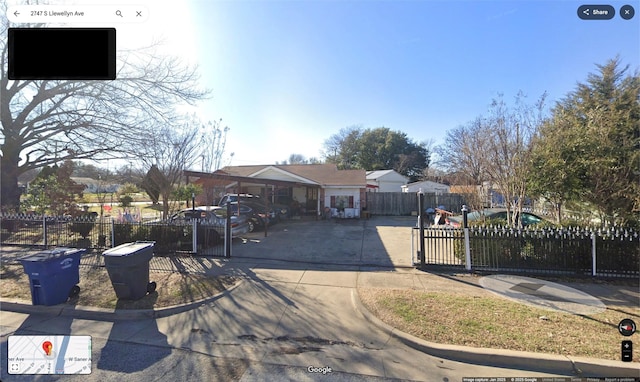 view of front of house featuring a fenced front yard and a gate