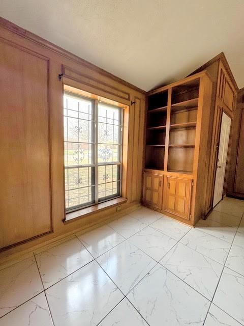 empty room featuring marble finish floor