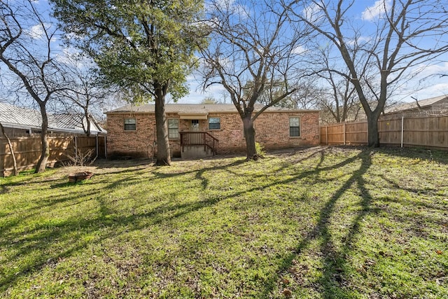 view of yard with a fenced backyard