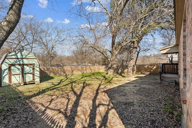 view of yard featuring an outbuilding and a fenced backyard