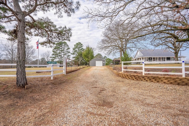 view of street featuring driveway and a gated entry