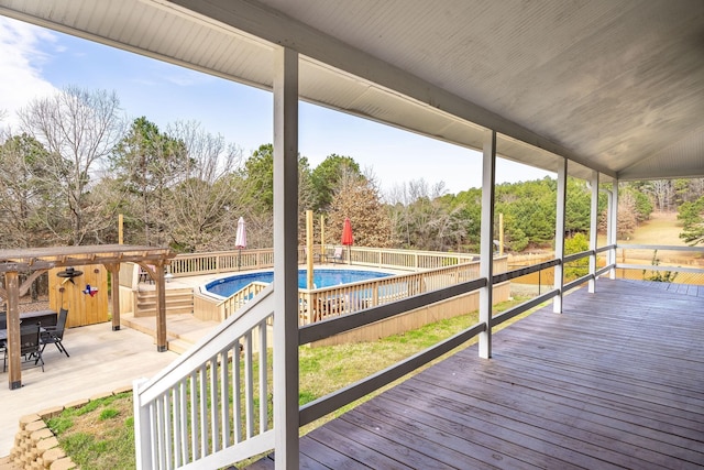 deck with a fenced in pool