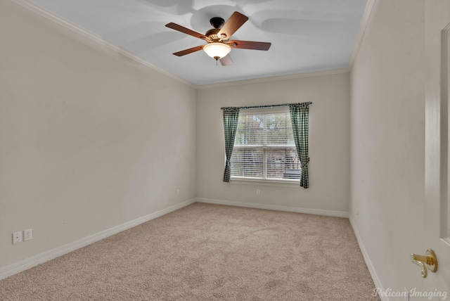 unfurnished room featuring crown molding, carpet, ceiling fan, and baseboards