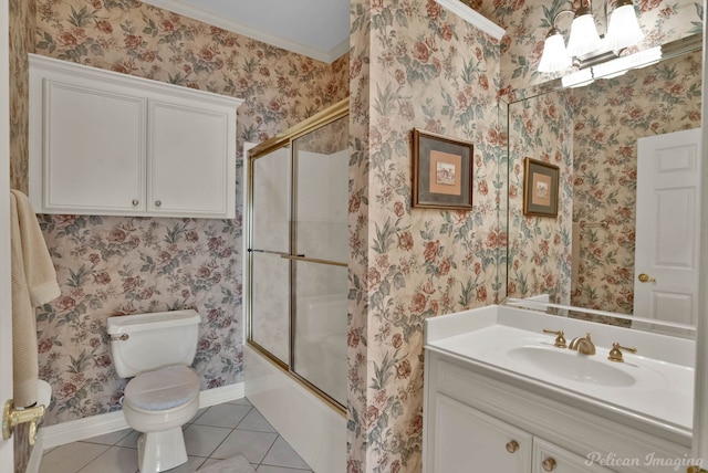 bathroom featuring wallpapered walls, toilet, tile patterned flooring, combined bath / shower with glass door, and vanity