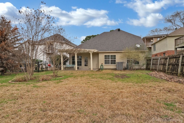 back of property featuring fence, cooling unit, a yard, a pergola, and stucco siding