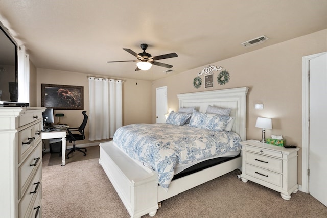 bedroom with a ceiling fan, visible vents, and light colored carpet