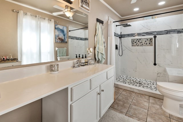 full bath featuring a marble finish shower, toilet, ornamental molding, ceiling fan, and vanity