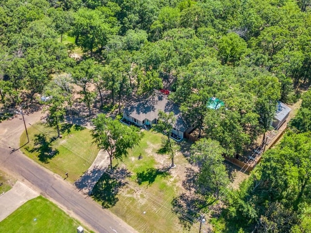 birds eye view of property featuring a wooded view