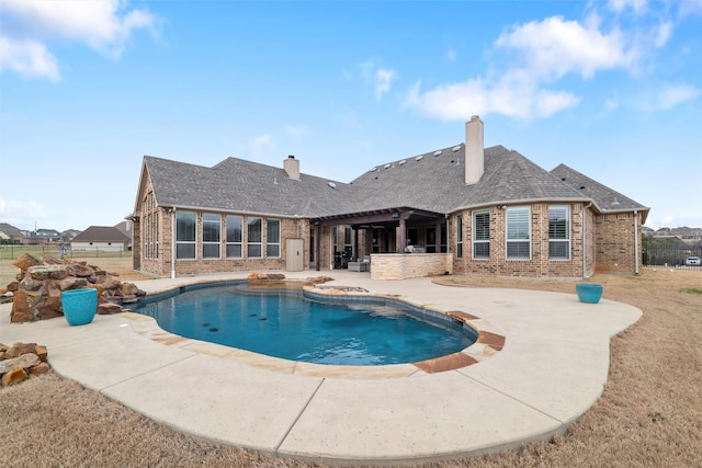 view of pool with fence, a pergola, a fenced in pool, and a patio