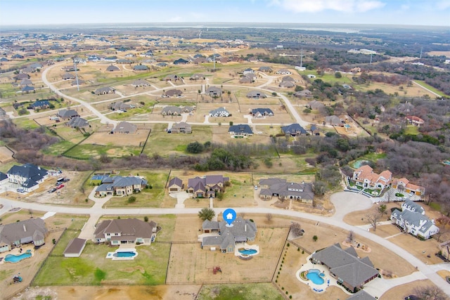 birds eye view of property with a residential view