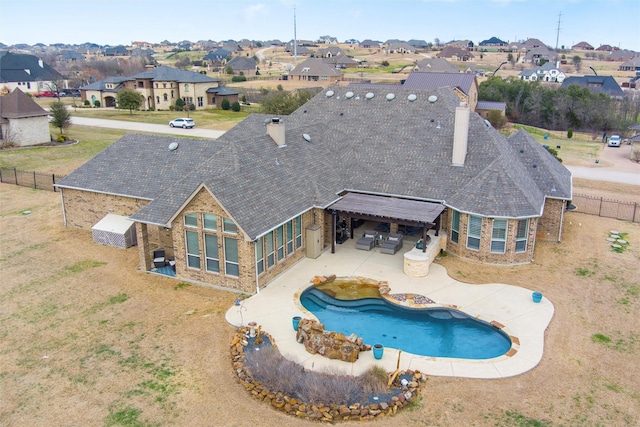 view of pool featuring a fenced in pool, a residential view, a fenced backyard, and a patio