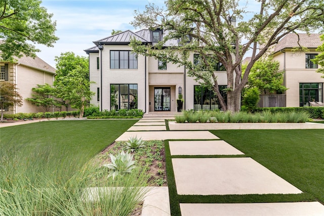 3220 Colgate Ave, University Park, TX 75225 - view of front of house featuring a standing seam roof, a front lawn, metal roof, and french doors