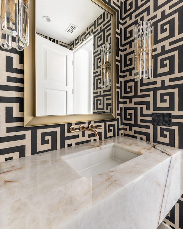 bathroom with a sink and visible vents