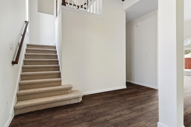 6114 Baskerville Dr, Rowlett, TX 75087 - staircase with wood finished floors and baseboards