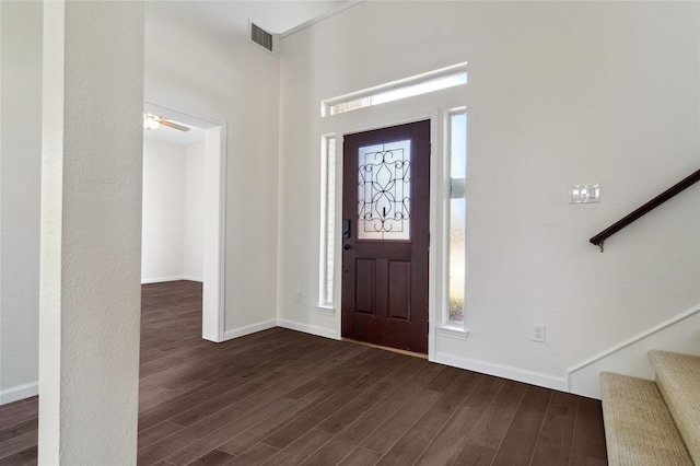 6114 Baskerville Dr, Rowlett, TX 75087 - entrance foyer with dark wood-style flooring, stairs, and baseboards