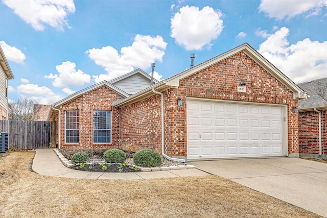 ranch-style home featuring brick siding, an attached garage, central AC unit, fence, and driveway