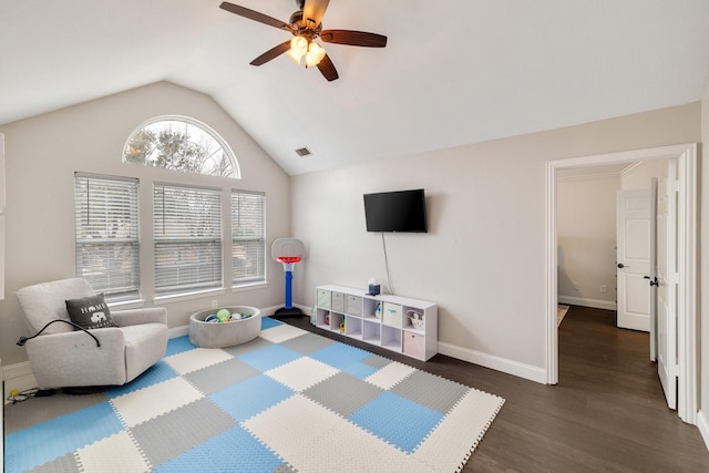 rec room with dark wood-style floors, baseboards, visible vents, and vaulted ceiling