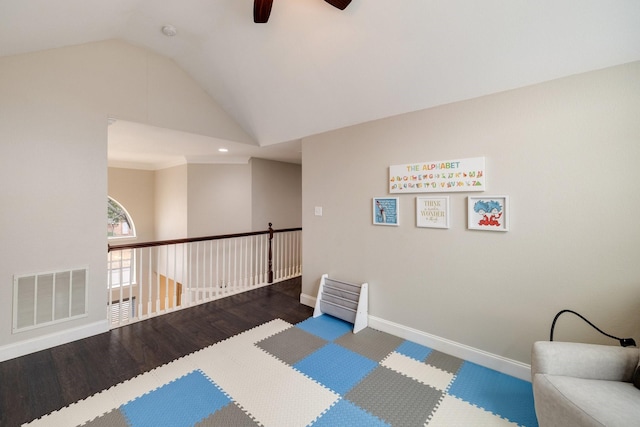 sitting room featuring lofted ceiling, visible vents, a ceiling fan, wood finished floors, and baseboards