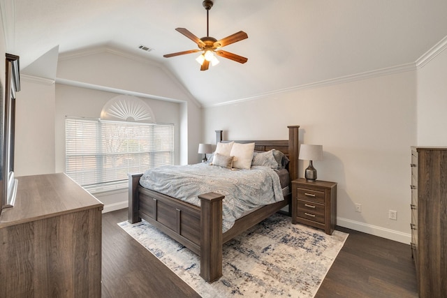 bedroom featuring lofted ceiling, dark wood-type flooring, visible vents, and baseboards