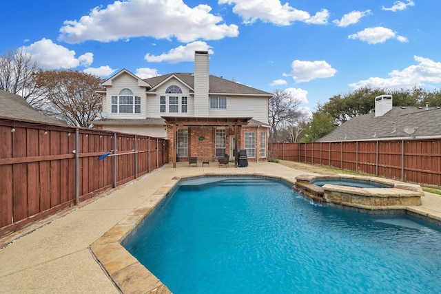 view of pool with a patio, a fenced backyard, a pool with connected hot tub, and a pergola
