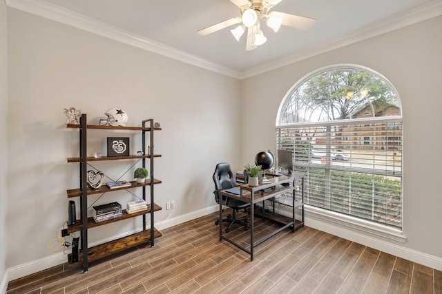home office featuring ornamental molding, wood tiled floor, ceiling fan, and baseboards