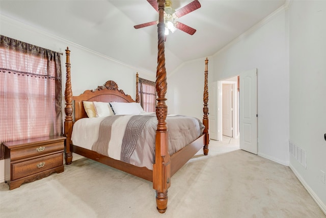 carpeted bedroom with visible vents, baseboards, ceiling fan, ornamental molding, and vaulted ceiling