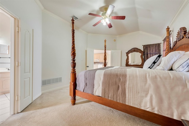 carpeted bedroom with vaulted ceiling, ensuite bath, visible vents, and crown molding