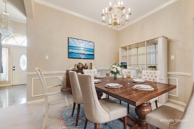 dining room featuring an inviting chandelier, ornamental molding, and light colored carpet