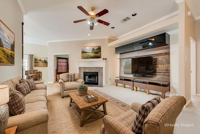 unfurnished living room with ceiling fan, carpet, visible vents, and crown molding