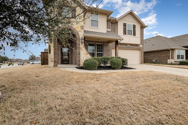 traditional-style home with brick siding, stucco siding, an attached garage, stone siding, and driveway