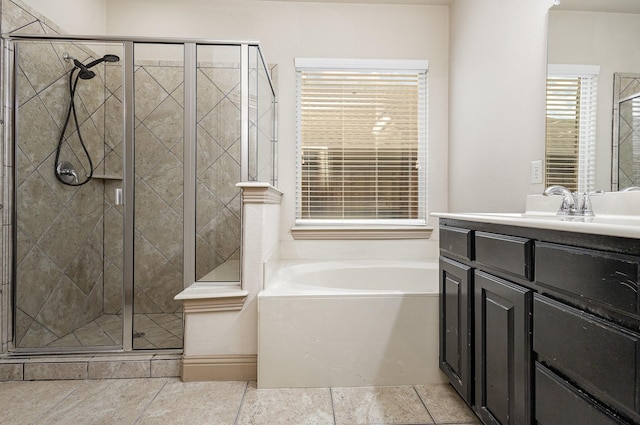 full bathroom featuring a garden tub, a stall shower, and vanity