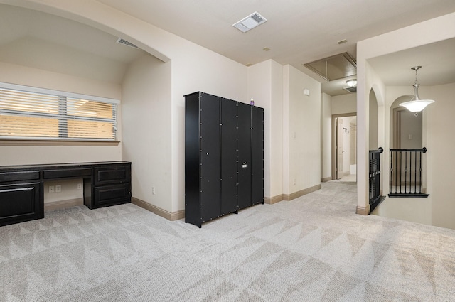 interior space featuring attic access, carpet flooring, baseboards, and visible vents