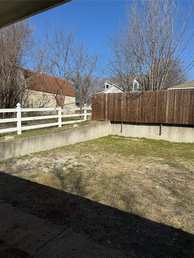 view of yard featuring fence