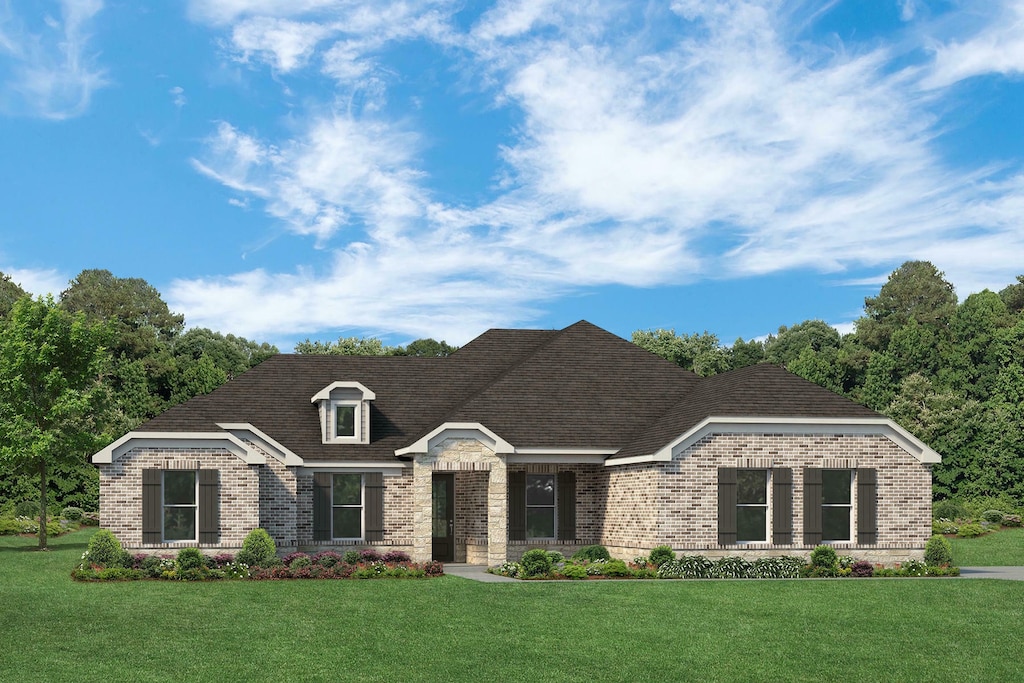 view of front of home featuring brick siding, a front lawn, and roof with shingles