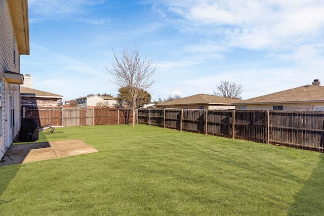 view of yard with a fenced backyard and a patio