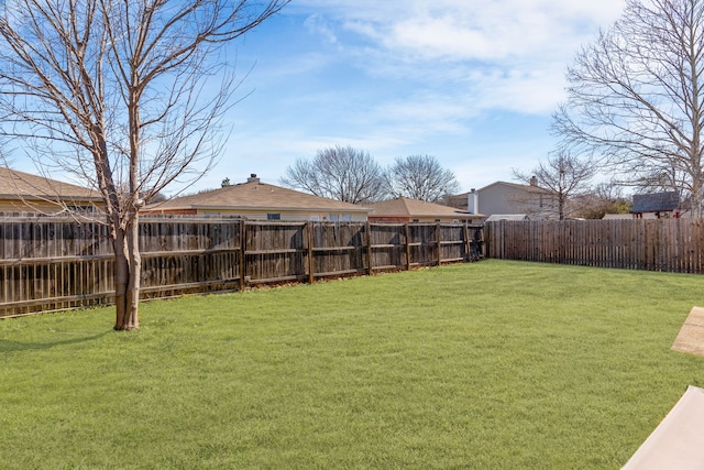 view of yard featuring a fenced backyard