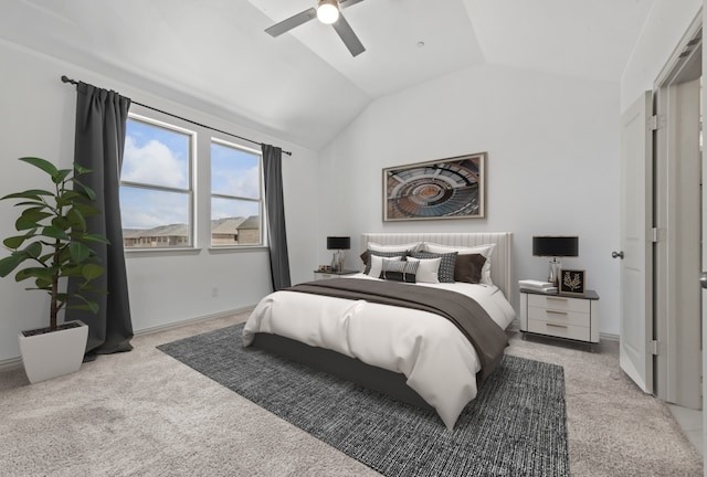 bedroom with lofted ceiling, ceiling fan, and light carpet