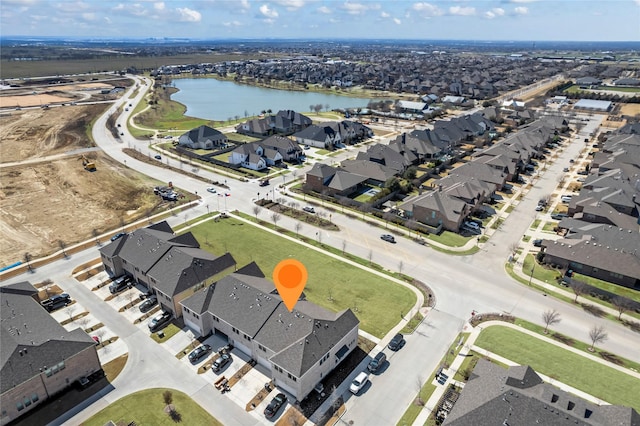 aerial view featuring a residential view and a water view