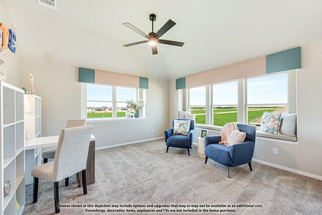 office space featuring lofted ceiling, carpet flooring, plenty of natural light, and baseboards