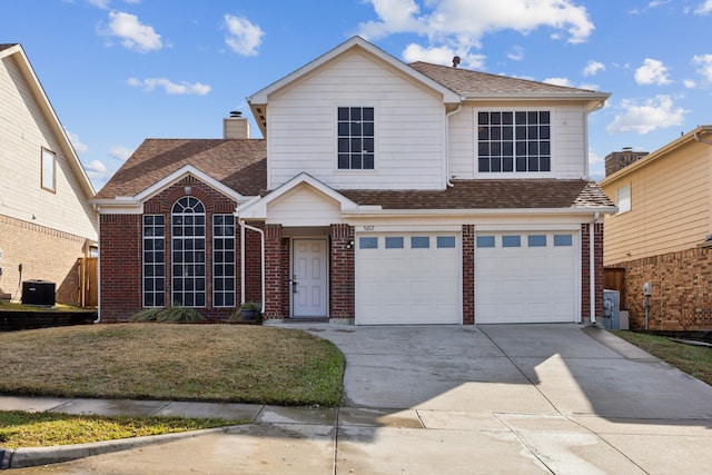 traditional-style house with an attached garage, brick siding, concrete driveway, roof with shingles, and a front yard