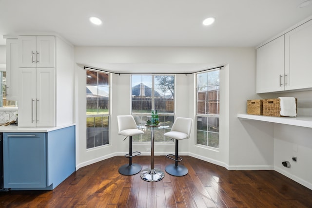 sitting room featuring recessed lighting, wood-type flooring, and baseboards