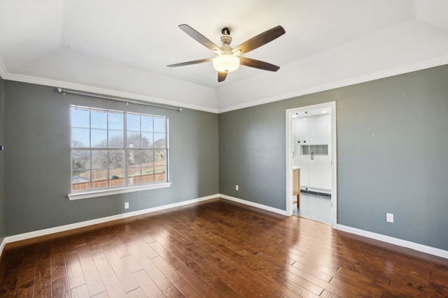 empty room with ceiling fan, ornamental molding, hardwood / wood-style flooring, and baseboards